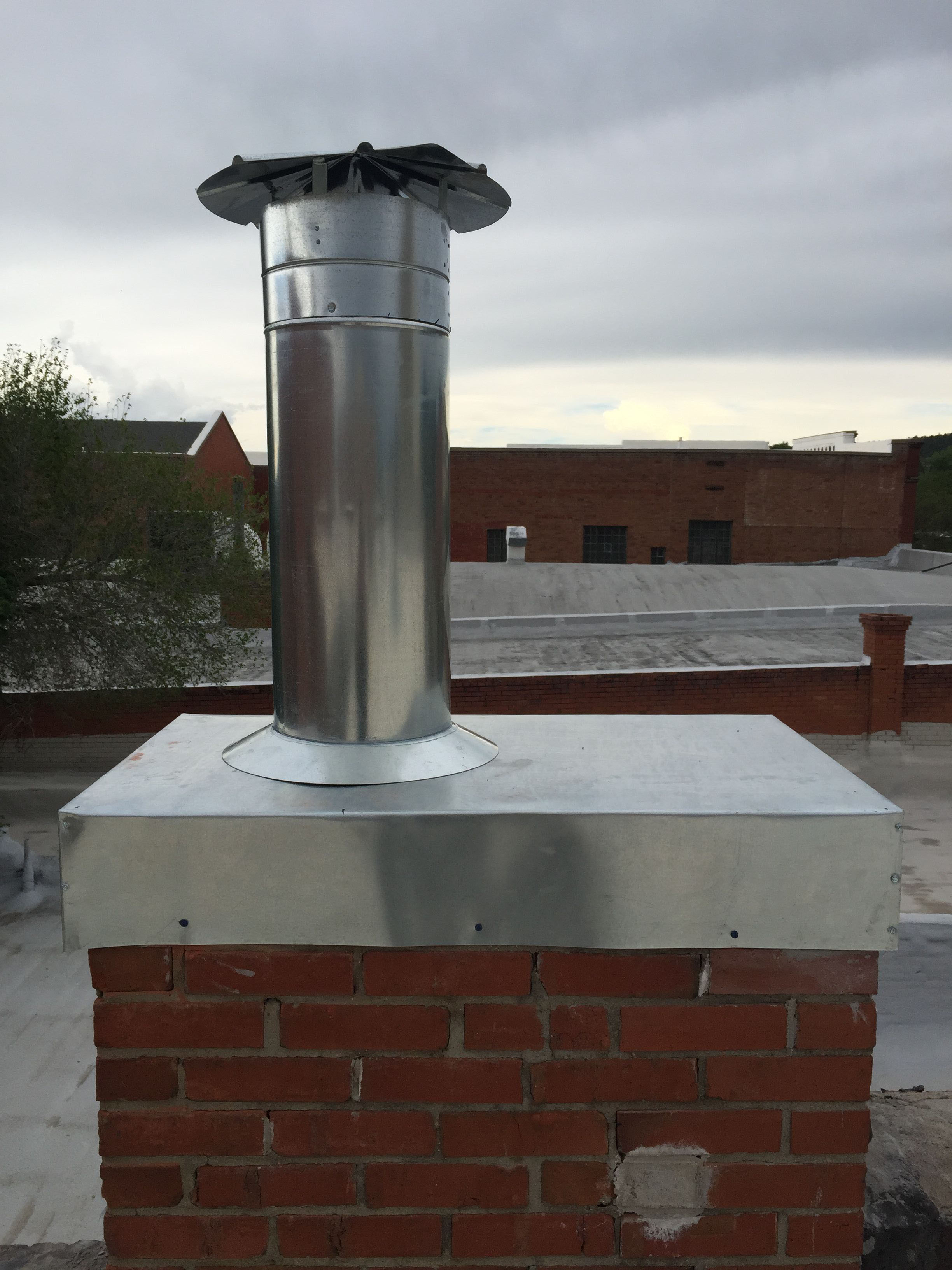 Chimney Cap and Vent Penetration
